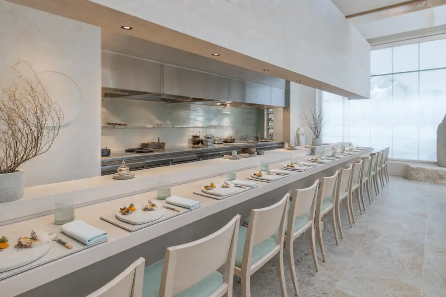 Fourteen-seat Lumi tasting counter with Nordic dishes plated for service